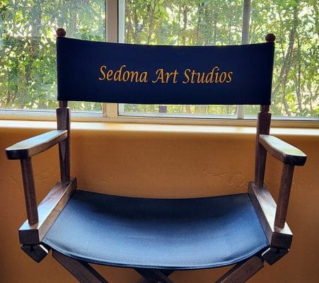 Director's chair in Clark Sheppard's Sedona art studio overlooking a north-facing bay window.